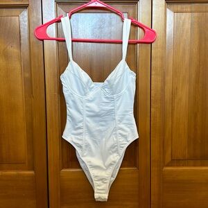 white bodysuit.